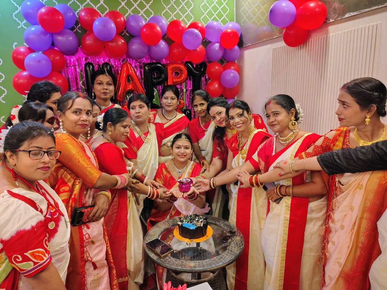 Teachers celebrating with a cake